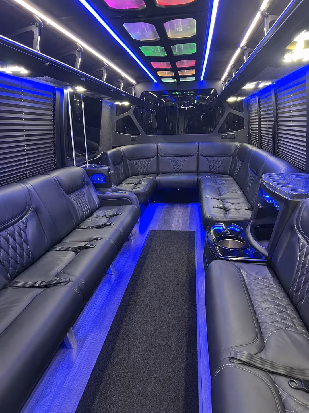 Friends laughing during a party bus celebration in Cincinnati