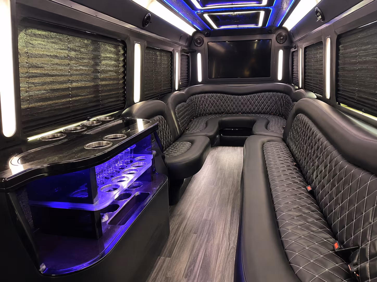 Wedding guests seated inside a party bus serving Cincinnati